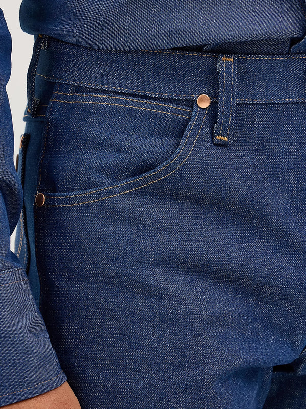 KONTOOR Wrangler men's cowboy cut original fit rigid indigo jeans, front view showing classic denim texture and stitching details.