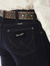 Men's Wrangler Cowboy Cut Silver Edition slim fit jeans in dark denim, showcasing classic western style and durable denim fabric.