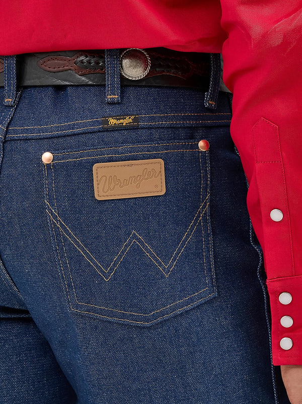 KONTOOR Wrangler men's cowboy cut slim fit jeans in rigid indigo denim, showing classic fit and sturdy fabric.