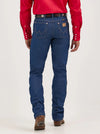 Men's Wrangler Cowboy Cut slim fit jeans in rigid indigo denim, by KONTOOR, showing front view with classic stitching and five-pocket design.