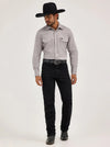 KONTOOR Wrangler men's cowboy cut slim fit jeans in shadow black, showing a close-up of the dark denim fabric and stitching details.