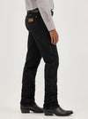 Men's Wrangler Cowboy Cut Slim Fit Jeans in Shadow Black, KONTOOR brand, shown hanging with a focus on the denim fabric.