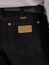 Men's Wrangler Cowboy Cut Slim Fit Jeans in Shadow Black, KONTOOR brand, showing the stylish black denim with classic stitching and fit.