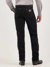 Men's Wrangler Cowboy Cut Slim Fit Jeans in Shadow Black by KONTOOR, showing front view with classic stitching and slim fit design.