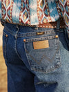 Men's Wrangler Cowboy Cut Original Fit jeans in stonewashed denim, styled for a classic Western look by KONTOOR.