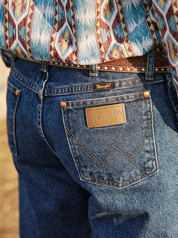 Men's Wrangler Cowboy Cut Original Fit jeans in stonewashed denim, styled for a classic Western look by KONTOOR.