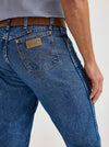 Men's Wrangler Cowboy Cut Original Fit jeans in stonewashed denim, showcasing classic Western style and durable construction.