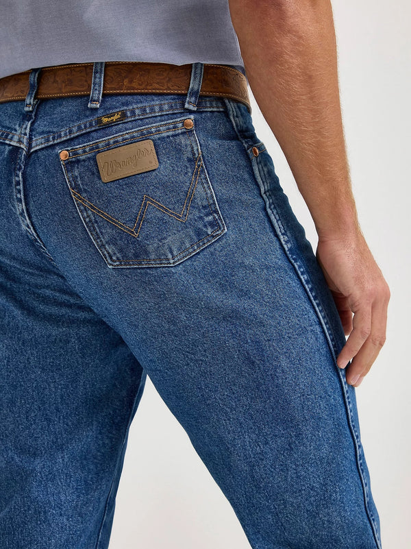 Men's Wrangler Cowboy Cut Original Fit jeans in stonewashed denim, showcasing classic Western style and durable construction.