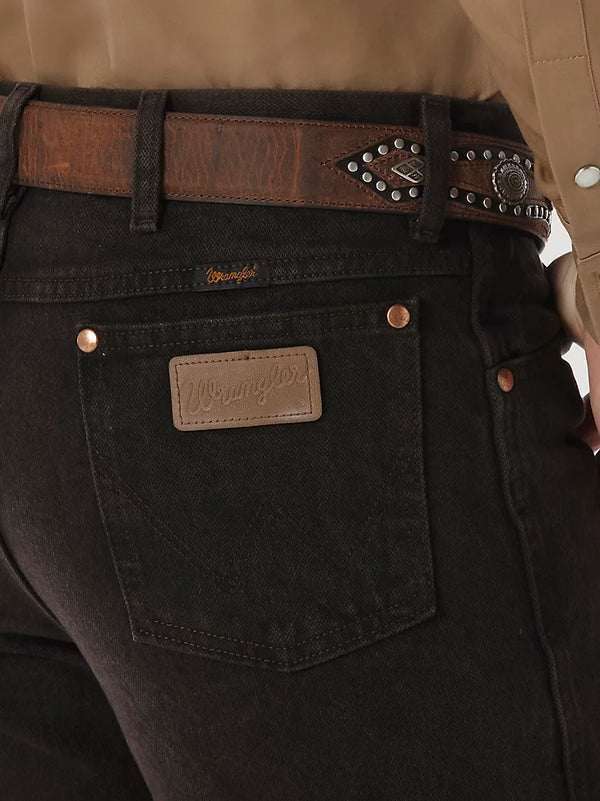 Men's Wrangler Cowboy Cut slim fit jeans in black chocolate, KONTOOR brand, showing the front view with classic style and stitching.
