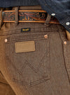 Men's Wrangler Cowboy Cut Slim Fit Jeans in Black Whiskey, showcasing classic denim style and tailored fit from KONTOOR.