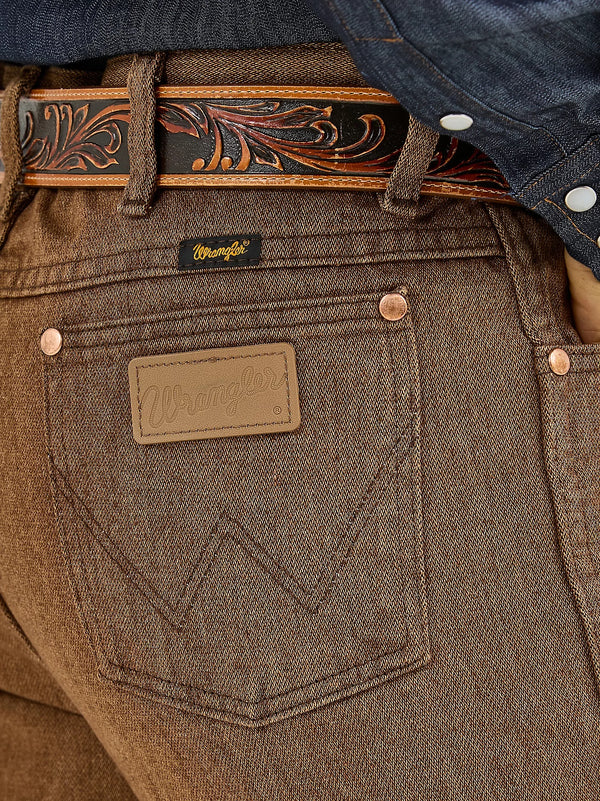 Men's Wrangler Cowboy Cut Slim Fit Jeans in Black Whiskey, showcasing classic denim style and tailored fit from KONTOOR.