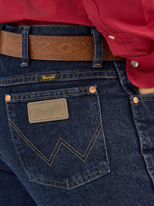 Men's Wrangler Cowboy Cut Slim Fit Jeans in dark stone wash, showing classic denim with a tailored fit and contrast stitching.