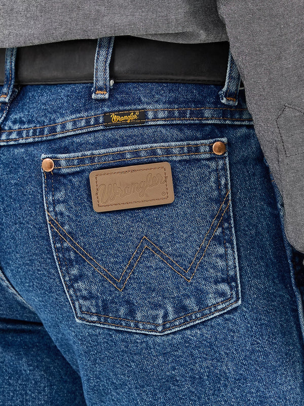 KONTOOR Wrangler men's cowboy cut slim fit jeans in stonewash denim, front view showing classic five-pocket design.