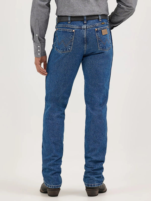 Men's Wrangler Cowboy Cut Slim Fit Jeans in stonewash denim, displayed in natural front view with classic stitching details.