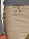 KONTOOR Wrangler men's cowboy cut slim fit jeans in tan, showcasing front view with classic stitching and sturdy denim fabric.