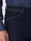 Men's navy Wrangler Cowboy Cut stretch slim fit jeans by KONTOOR, showcasing the classic denim style and tailored fit.