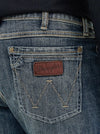 Men's Wrangler Retro Slim Fit Bootcut Jeans in Layton by KONTOOR, featuring classic denim with a stylish fit and bootcut leg design.