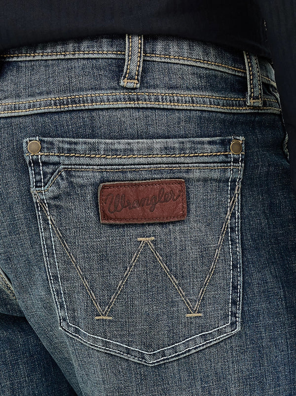 Men's Wrangler Retro Slim Fit Bootcut Jeans in Layton by KONTOOR, featuring classic denim with a stylish fit and bootcut leg design.