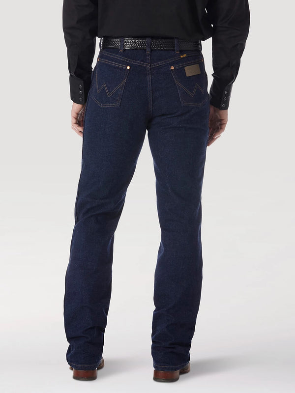 Men's Wrangler Cowboy Cut stretch regular fit jeans in navy, made by KONTOOR, showing front view with classic denim details.