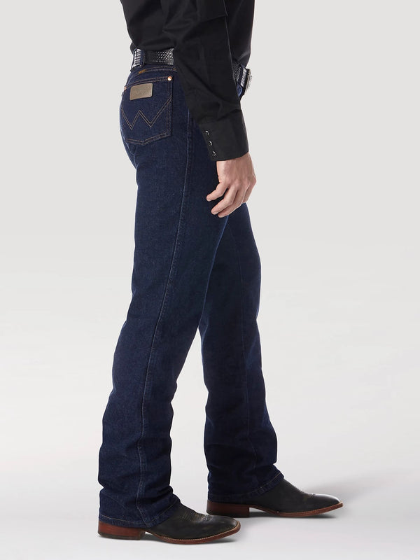 Men's navy Wrangler Cowboy Cut Stretch jeans by KONTOOR, showing the classic fit and denim fabric with stitching details.