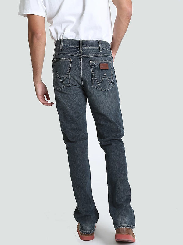 Men's Wrangler Retro Slim Fit Straight Leg Jeans by KONTOOR, showing classic blue denim with a modern slim silhouette.