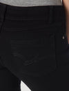 Women’s black Wrangler mid-rise jeans by KONTOOR, showcasing a fitted denim style with classic five-pocket design.