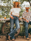 KONTOOR Wrangler Women Retro Mae Jean in Deadwood wash, classic high-waisted denim jeans, front view with logo detail