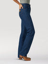 KONTOOR Wrangler women’s cowboy cut slim fit jeans in prewashed indigo denim, showcasing classic five-pocket design and tapered leg.