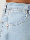 KONTOOR Wrangler women's cowboy cut slim fit jeans in bleach wash, featuring classic denim style and fitted silhouette.
