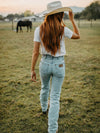 KONTOOR Wrangler women's cowboy cut slim fit bleach jeans showing distressed denim and classic five-pocket design