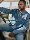 KONTOOR Wrangler men denim snap work shirt with long sleeves and button closures, casual workwear in classic blue denim fabric.