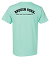Unisex Broken Horn logo tee featuring a broken horn half circle design on a casual T-shirt.